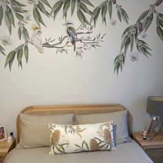 a bedroom with a bird painted on the wall