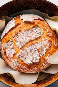 a loaf of bread sitting inside of a pan