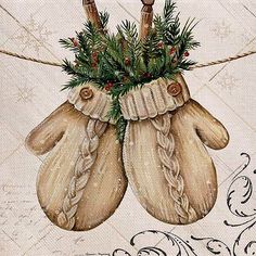 two mittens hanging from a rope with holly and berries on them, decorated with twine