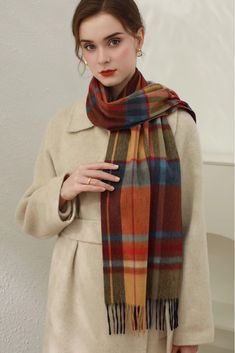 Cashmere Elegance in Classic Plaid Add a touch of luxury and style to your winter ensemble with our Christmas Plaid Cashmere Fringe Scarf. Made from plush cashmere, this scarf offers exceptional warmth without the bulk. The classic Scottish plaid design makes it a versatile piece for any outfit. Measuring 180cm x 30cm, it can be worn as a scarf or shawl for added convenience. Style #: WKAI510 Elegant Brown Scarves For Winter, Elegant Brown Winter Scarves, Classic Red Scarves For Winter, Red Wool Winter Scarves, Red Wool Scarves For Winter, Formal Wool Scarves For Winter, Elegant Red Scarf For Fall, Winter Formal Multicolor Outerwear, Elegant Multicolor Scarves For Fall