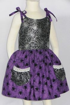 "Baby Girls Halloween Dress with Spiders and Spider Webs! Cotton Boutique Sundress for Halloween in Black fabric with Silver Spider Webs with a Purple Spider Skirt. Perfect for Halloween Parties, School Parties, Pictures and the Pumpkin Patch. Infant and Baby sizes 0 - 24 months. Little Girls Dress has Pockets for all her goodies and Buttons in the back with adjustable Shoulder Tie Straps perfect for layering. Handmade Made USA by me! Running out of Original Purple Spider FabricSee Picture 7 for Spider Dress, Girls Western Dresses, Girls Halloween Dress, Purple Spider, Create Kids Couture, Toddler Size Chart, Valentine Dress, Girls Halloween