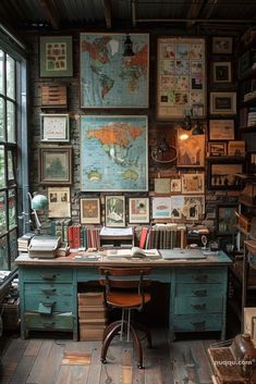 an old desk with lots of books and pictures on the wall in front of it