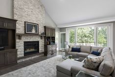 a living room with couches and a fireplace