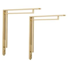 two gold metal brackets on a white background