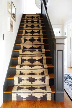 the stairs in this house are decorated with rugs