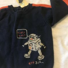 NWt gymboree cutiepie robot sweater 9 12 M  9-12 months  9-12 mos brand new with tags from vintage -- rare piece to find gymborees cutie pie robot technology line adorable robot on a navy blue sweater with orange trim robot is walking and saying BLEEP BLEEP perfect for the parent tech's baby QT pie layette line vintage early 2000 's at gymboree stores also good for holidays christmas hanukkah new years valentines thanksgiving birthdays party parties Cute Blue Sweater For Playtime, Monster Sweater, Thanksgiving Birthday Parties, Vintage Sweater Toddler, Early 2000’s, Gymboree Girl Outfits, Robot Technology, Vintage Gymboree, Thanksgiving Birthday