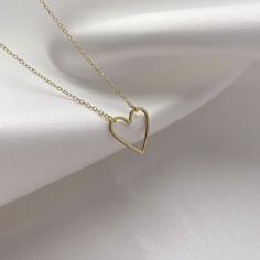 Thank her for being such a sweet heart with this stunning heart necklace ♥  This beautiful heart necklace is crafted with a dainty yellow gold vermeil heart pendant, measuring 13x14mm. The heart sits on a yellow gold vermeil belcher chain which measures between 16" and 18" sitting a few inches below the collar bone for most ladies.  Our yellow gold vermeil jewellery is made with genuine .925 sterling silver which has been expertly plated with a yellow gold layer.  Presented on fresh white premiu Minimalist Gold Necklace With Heart Beads, Gold Minimalist Heart Beads Necklace, Dainty Yellow Gold Necklaces With Heart Beads, Delicate Yellow Gold Heart Necklace With Round Pendant, Minimalist Yellow Gold-plated Heart Necklace, Minimalist Yellow Gold Plated Heart Necklace, Minimalist Yellow Gold Necklace For Valentine's Day, Delicate Yellow Gold Heart Necklace, Delicate Heart Pendant Necklace With Clavicle Chain