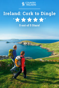 two children with backpacks looking out at the ocean and cliffs, ireland cork to dingle 5 out of 5 stars