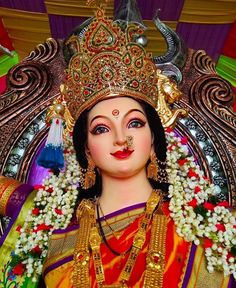 a statue of the hindu god, lord hanshrat with flowers in her hair