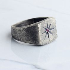 Compass signet silver man ring has been carefully designed and handcrafted for you, inspired by the unique pole star that shines brightly in the darkness of the sky. We presented our ring as white bronze (silver plated) or 925 sterling silver. This ring, which is suitable for daily use and at the same time very stylish, can be an anniversary gift or a memorial gift for your loved ones, and it will come properly packaged as a gift. As NuaSilverRings, we guarantee that we will help you with any pr Star Ring Men, Thumb Rings Men, Compass Ring, Man Band, Star Silver, Man Ring, Ring Man, Signet Ring Men, Pole Star