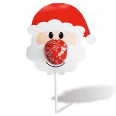 a lollipop with a santa clause hat on it's head and eyes