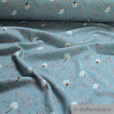 the fabric is blue with small white flowers on it, and has been folded over