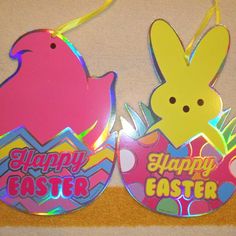 two happy easter tags on a wall