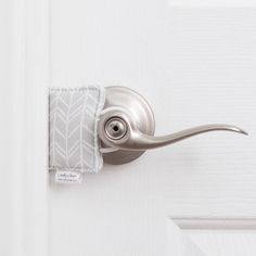 a close up of a door handle on a white door