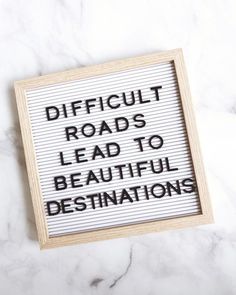 a sign that says difficult roads lead to beautiful destinations