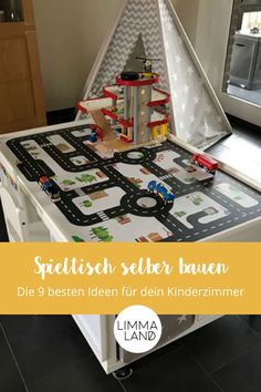 a child's play table with a toy train set in it and the words, spieltsch selber lauen dien