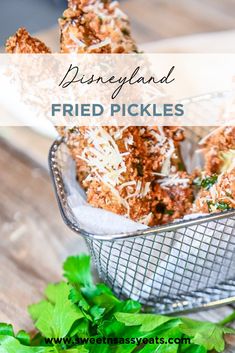 fried pickles in a basket with parmesan cheese and parsley on top