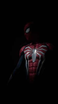 the amazing spider - man is seen in this dark photo, with his glowing chest