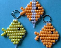 three key chains made to look like beads