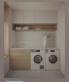 a washer and dryer in a small room