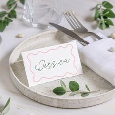 a place setting with napkins and silverware