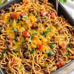 a casserole dish with ground beef and tomatoes