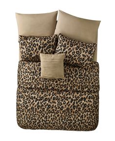 a leopard print comforter set with two pillows