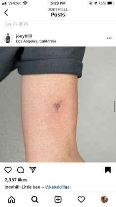 the back of a woman's leg with a small tattoo on her left arm