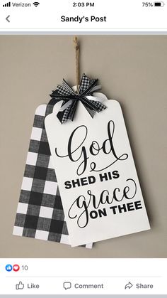 a white and black tag that says god shed his grace on the vine with a bow