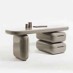 a table with three stools on it and a pen resting on top of one