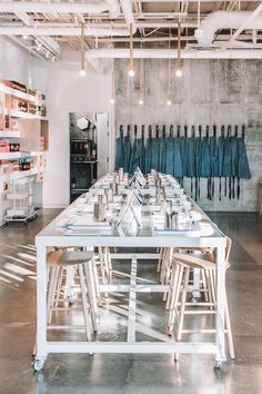 a long table with several chairs in front of it