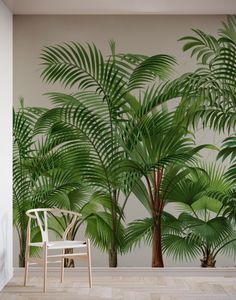 a chair sitting in front of a palm tree wall mural