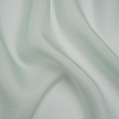 Wash a wave of elegance over your wardrobe with this Famous Australian Designer Seafoam Silk Organza. From bridesmaids to prom dresses, holiday dinners to cocktail hours, silk organza commands any room with its voluminous drape and ethereal transparency. Displaying a pale seafoam color, the crisp and sleek face brings an allure of romance to structured blouses, skirt overlays, lustrous gowns, and more. A lining may be desired depending on the application. Seafoam Color, Dresses Holiday, Holiday Dinners, Silk Organza, Australian Design, Cocktail Hour, Sea Foam, Prom Dresses, Blouses