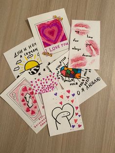 six handmade valentine cards on a table