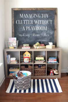 a room with a chalkboard, bookshelf and baskets