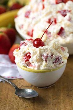 two bowls filled with ice cream and cherries