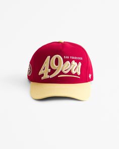 a red and yellow cap with the number forty four printed on it's peak