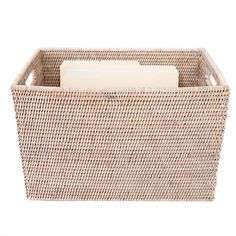 a wicker basket with a soap bar in the bottom and an eraser on top