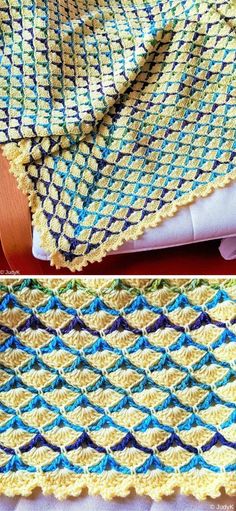 crocheted blanket with blue, yellow and green stripes on the edges is shown