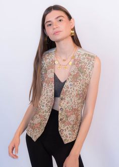 "Vintage 90s Liz Claiborne floral carpet vest. This classic 90s vest comes in the prettiest dusty pink floral print. V-neckline. Sleeveless. Back adjustable belt buckle. Front button fastening. Fully lined. We kindly ask that you please view all measurements for comparison so you can get your desired fit. * Brand: Liz Claiborne * Decade: 1990s * Fabric: 57% Rayon, 43% Cotton * Lining: 100% Rayon back & lining * Color: Light Beige with Dusty Pink Floral Print C O N D I T I O N * Excellent vin Retro V-neck Vest For Spring, Vintage V-neck Vest For Spring, Spring Floral Print V-neck Vest, Retro V-neck Spring Vest, Retro Spring Vest, Fitted Vintage V-neck Vest, Spring V-neck Retro Vest, Fall Floral Print Sleeveless Vest, Spring Vintage Vest