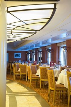 a dining room with many tables and chairs