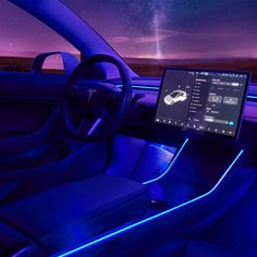 the interior of a car is lit up with blue lights and features an illuminated dashboard