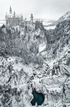 an aerial view of a castle in the snow