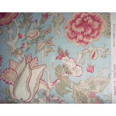 an old wallpaper with flowers and birds on it's blue backgroun