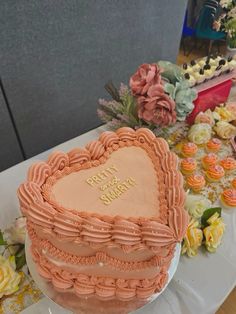 a heart shaped cake sitting on top of a table