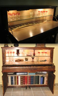 an old piano has been converted into a book shelf with wine glasses and books in it