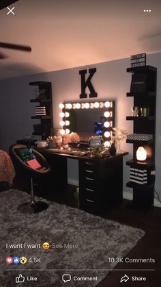 a bedroom with a vanity, mirror and lights on the wall above it's desk