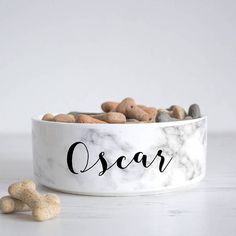 a white bowl filled with lots of rocks