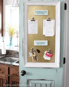 an old door is decorated with magnets and papers on the front, along with other kitchen items