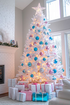 a white christmas tree with blue and pink ornaments